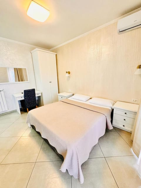 Bed, Photo of the whole room, Bedroom, towels, air conditioner