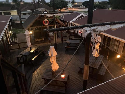 Property building, Patio, Night, People, Decorative detail, Swimming pool, group of guests