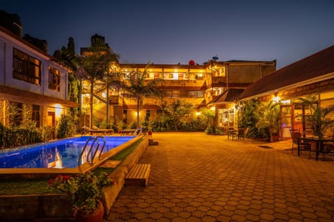 Property building, Patio, Night, Pool view, Swimming pool, sunbed