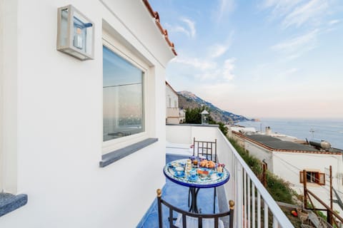 Property building, Patio, Balcony/Terrace, Balcony/Terrace, Decorative detail, Guests, Landmark view, Mountain view, Sea view, Street view, Breakfast, Continental breakfast, Italian breakfast, children, young children, older children, group of guests