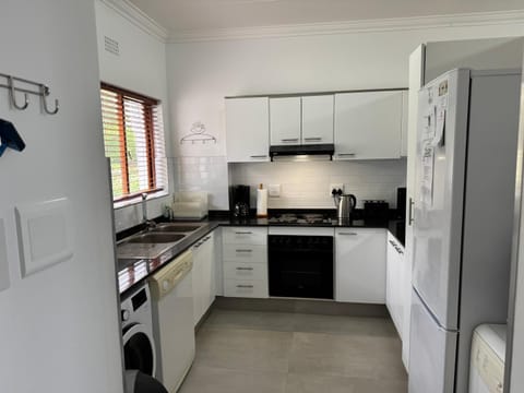 Kitchen or kitchenette, dishwasher, oven, stove, toaster, washing machine, dryer