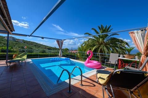 Patio, Day, Natural landscape, Pool view, Swimming pool, sunbed
