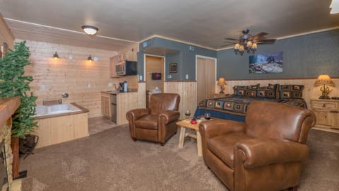 Bed, Kitchen or kitchenette, Living room, Seating area, Bath, fireplace, minibar