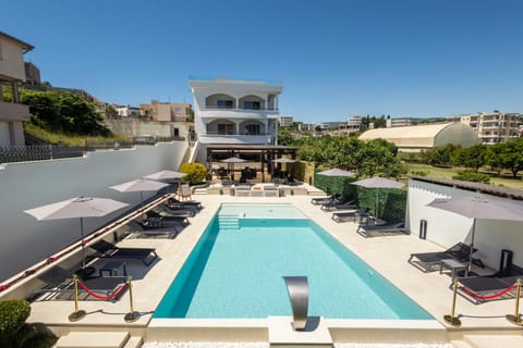 Property building, Patio, Balcony/Terrace, Pool view, Swimming pool, sunbed