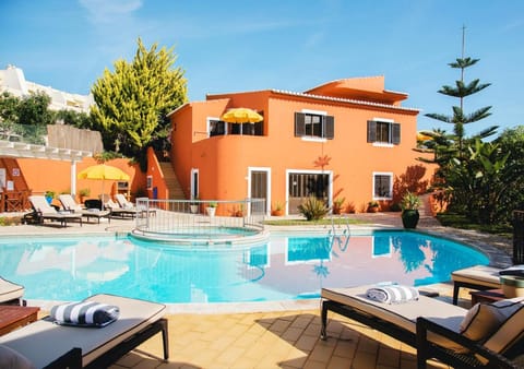 Property building, Patio, Day, Natural landscape, Swimming pool, sunbed