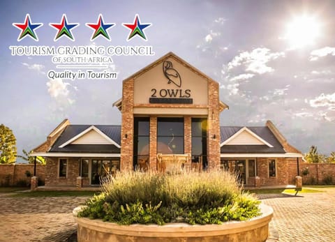 Property building, Day, Property logo or sign, Logo/Certificate/Sign, Text overlay, Landmark view, Certificate/Award