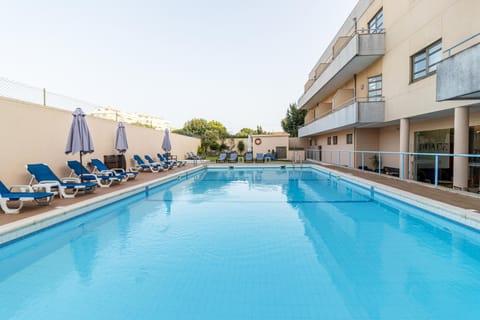 Property building, Swimming pool, sunbed