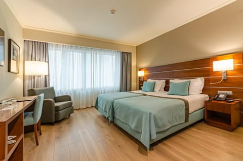 Bed, TV and multimedia, Living room, Seating area, Bedroom