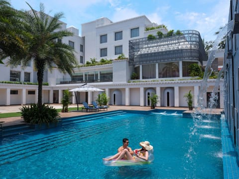 Property building, Facade/entrance, Day, People, Natural landscape, Garden view, Pool view, Swimming pool, group of guests, sunbed