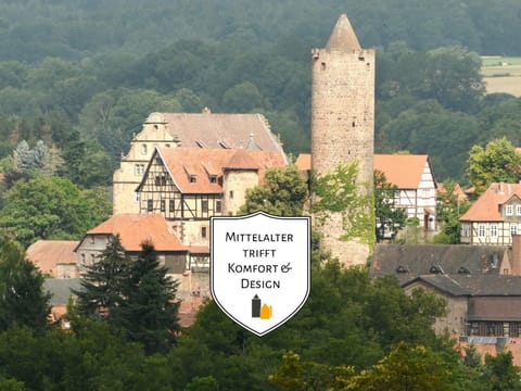 Property building, Nearby landmark, Day, Property logo or sign, Neighbourhood, Natural landscape, Logo/Certificate/Sign, Text overlay, Landmark view, Mountain view