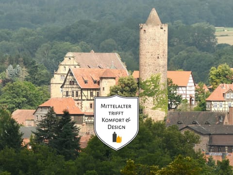 Property building, Nearby landmark, Day, Property logo or sign, Neighbourhood, Natural landscape, Summer, Logo/Certificate/Sign, Text overlay, Landmark view, Mountain view