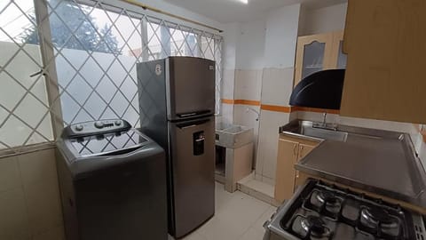 Kitchen or kitchenette, washing machine