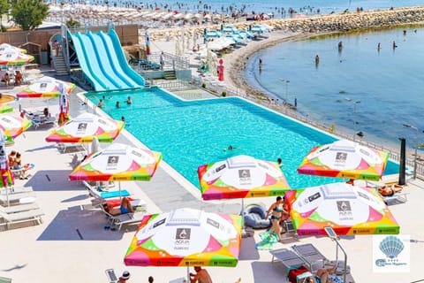 People, Natural landscape, Aqua park, Pool view, Swimming pool, sunbed