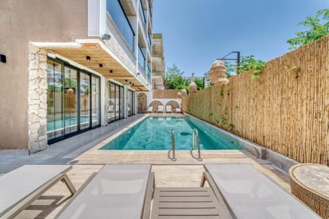 Property building, Pool view, Swimming pool, sunbed