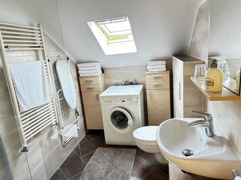 Toilet, Bathroom, towels, washing machine