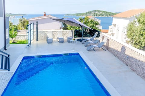 Property building, Patio, Day, View (from property/room), Balcony/Terrace, Seating area, Pool view, Sea view, Area and facilities, Swimming pool, sunbed