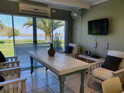 Living room, Decorative detail, Seating area, Dining area, River view