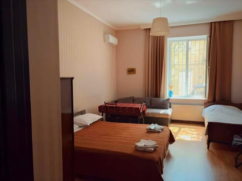 Bed, Living room, Photo of the whole room, Seating area, Bedroom, towels, air conditioner