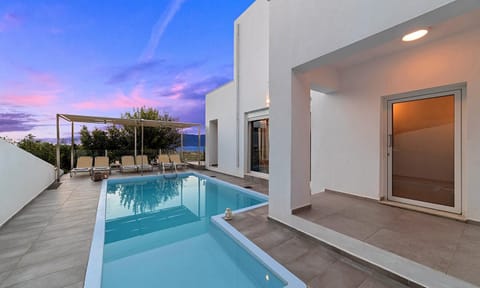 Property building, Patio, Pool view, Swimming pool, sunbed