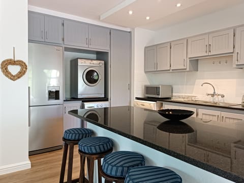 Drinks, dishwasher, minibar, toaster, washing machine, dryer