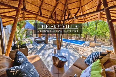 Patio, Day, Natural landscape, Garden, Living room, Seating area, Text overlay, Garden view, Pool view, Swimming pool, sunbed