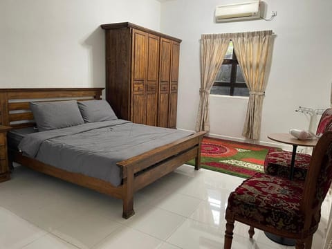 Seating area, Bedroom, hair dryier, towels, wardrobe, air conditioner