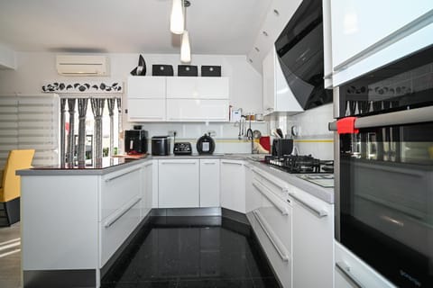 Kitchen or kitchenette, dishwasher, oven, stove, toaster