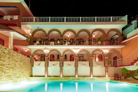 Property building, Patio, Night, Pool view, Swimming pool