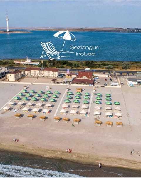 Property building, Nearby landmark, Restaurant/places to eat, Day, Natural landscape, Bird's eye view, Children play ground, Beach, Lake view, Sea view, Parking, sunbed