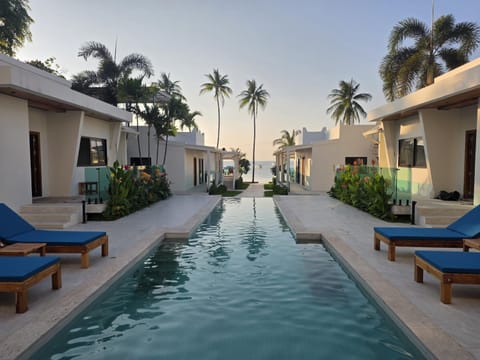 Property building, Day, Natural landscape, Pool view, Swimming pool, Swimming pool, sunbed