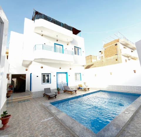 Property building, Patio, Day, Pool view, Swimming pool, sunbed