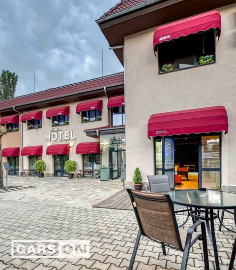 Property building, Patio, Facade/entrance, Day, View (from property/room), Balcony/Terrace, Text overlay, Location