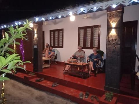 Patio, Night, People, Living room, Seating area, Dining area, group of guests