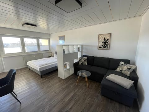 Bed, Living room, Seating area, Bedroom