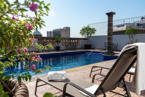 Property building, Day, Pool view, Swimming pool, sunbed