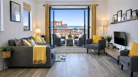 TV and multimedia, View (from property/room), Living room, Seating area, Sea view