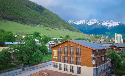 Property building, Nearby landmark, Spring, Day, Neighbourhood, Natural landscape, Bird's eye view, Mountain view