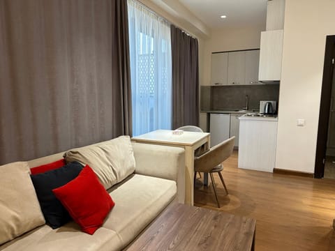 Kitchen or kitchenette, Living room, Seating area, Dining area