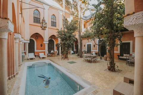 Property building, Patio, Day, Natural landscape, Pool view, Swimming pool