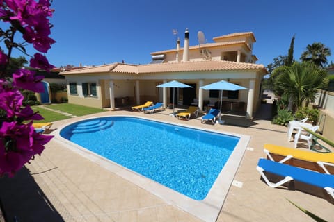 Property building, Patio, Pool view, Swimming pool, sunbed