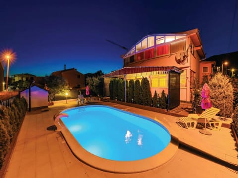 Property building, Night, Pool view, Swimming pool, sunbed