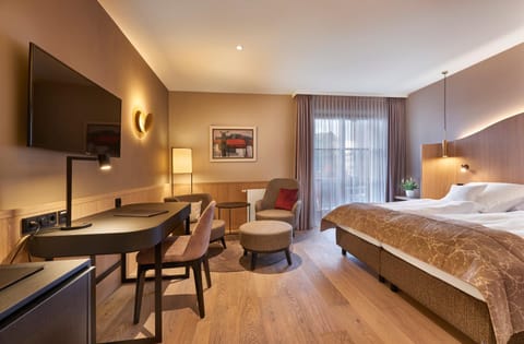 Bed, TV and multimedia, Living room, Seating area, Bedroom, hair dresser