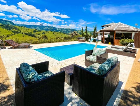 Patio, Day, Natural landscape, Living room, Seating area, Mountain view, Pool view, Swimming pool, sunbed