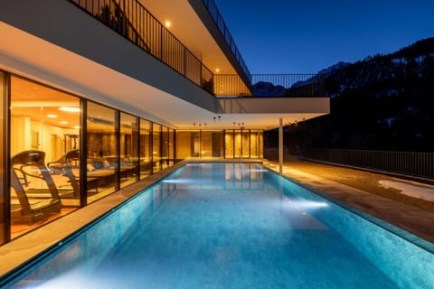 Property building, Night, Natural landscape, Pool view, Swimming pool, sunbed