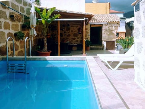 Property building, Patio, BBQ facilities, Swimming pool, sunbed