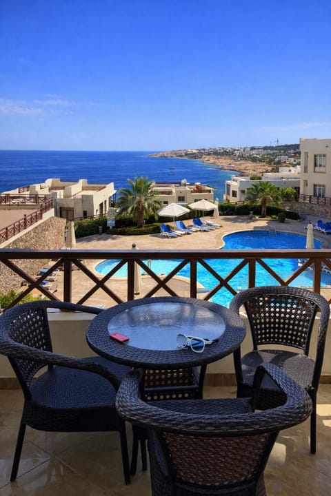 Balcony/Terrace, Living room, Seating area, Pool view, Sea view, Swimming pool
