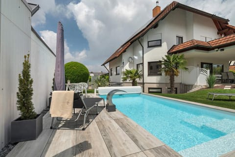 Property building, Living room, Swimming pool