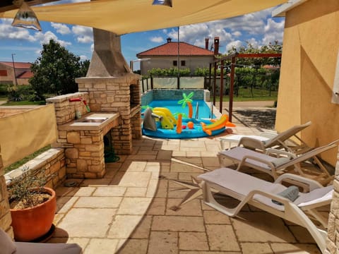 Patio, Day, Natural landscape, Pool view, Swimming pool, sunbed