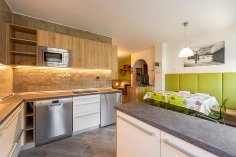 Kitchen or kitchenette, dishwasher, oven, stove