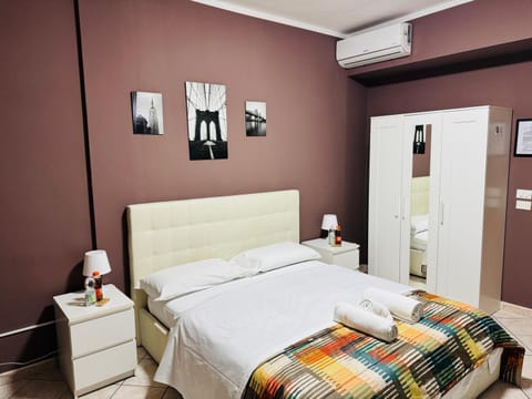 Bed, towels, air conditioner